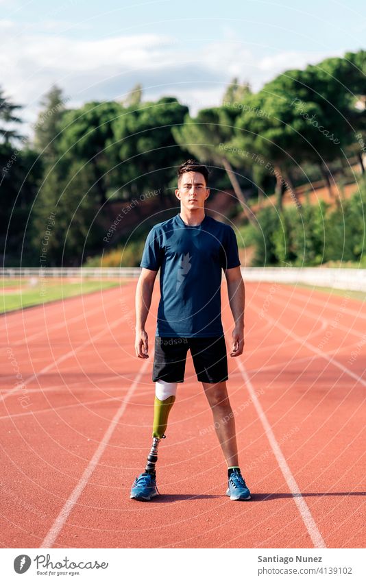 Athlete with leg prosthesis portrait athlete boy young man runner running sport prosthetic disability disabled amputation amputee sports sports wear