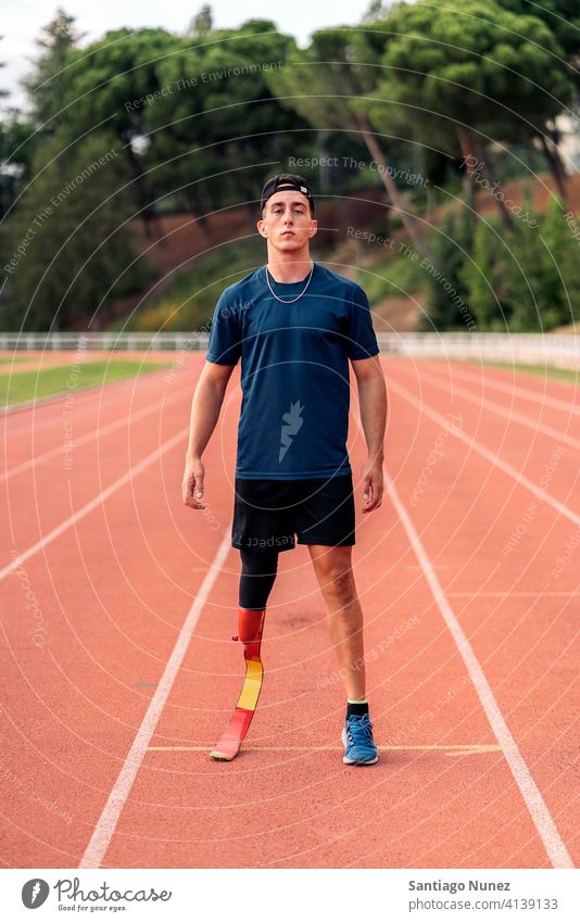 Athlete with leg prosthesis portrait athlete boy young man runner running sport prosthetic disability disabled amputation amputee sports sports wear