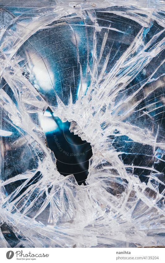 Textured image of a damaged glass broken texture crystal hole background surface vandal vandalism white blue strike cracked backdrop textured sharp sharped