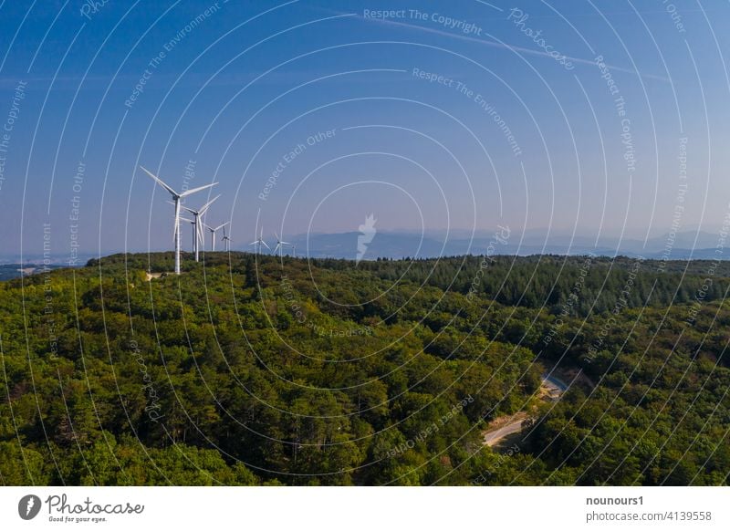 Wind farm in the forest generates electricity Wind energy plant Sky Energy industry Electricity Industry Ecological Renewable energy Environment Alternative