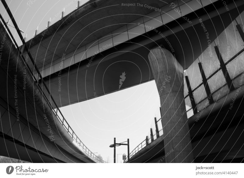 Urban highway over and next to each other Bridge Bridge pier Cloudless sky Bridge construction Architecture Contrast Traffic infrastructure Manmade structures