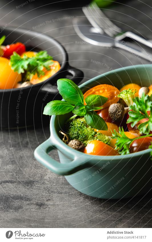 Fresh salad in bowls on table vegetable fresh ingredient various tomato mushroom basil rosemary tasty cuisine delicious kitchen food meal gourmet dish