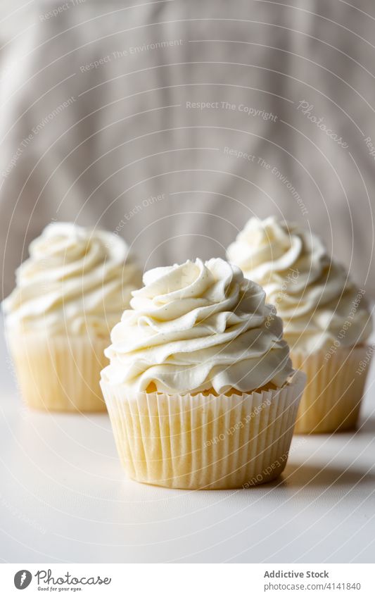Sweet cupcakes on tray in restaurant vanilla cream sweet dessert tasty gourmet delicious yummy fresh treat pastry food meal bakery tradition cuisine appetizing
