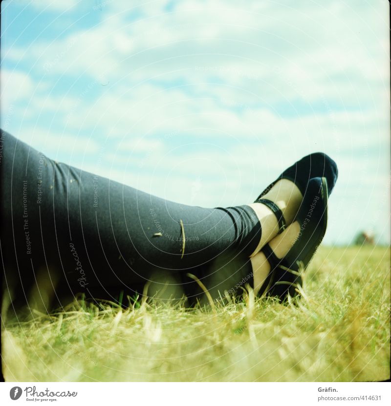 Just relax Human being Feminine Young woman Youth (Young adults) Legs Feet 1 30 - 45 years Adults Sky Clouds Park Meadow Lie Blue Green Black Serene Calm