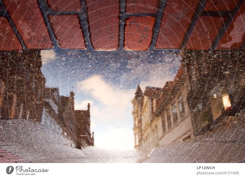 Lüneburg shopping mile Puddle Town Reflection in the water puddle photo House (Residential Structure) Old town Building City trip Shopping street Ground surreal