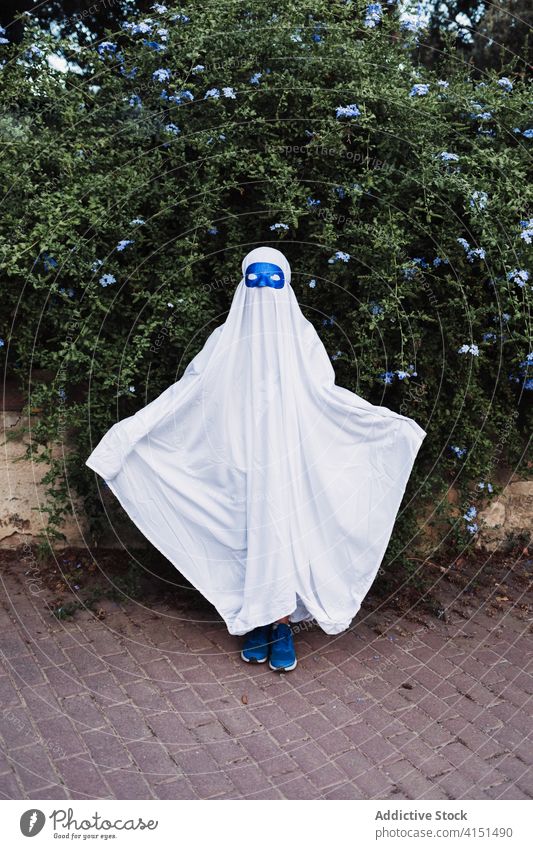Anonymous kid in costume during Halloween ghost halloween child holiday gloomy creepy event autumn scary entertain spooky celebrate season fall fantasy
