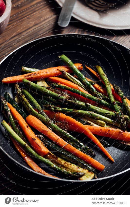 carrot, asparagus Carrot, asparagus and zucchini sauteed in the pan, on the table zucchini sauteed in the pan, on the table gourmet carrots concept modern mix