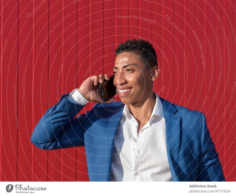 Ethnic businessman talking on phone smartphone call formal style conversation communicate elegant classy well dressed ethnic entrepreneur executive modern male