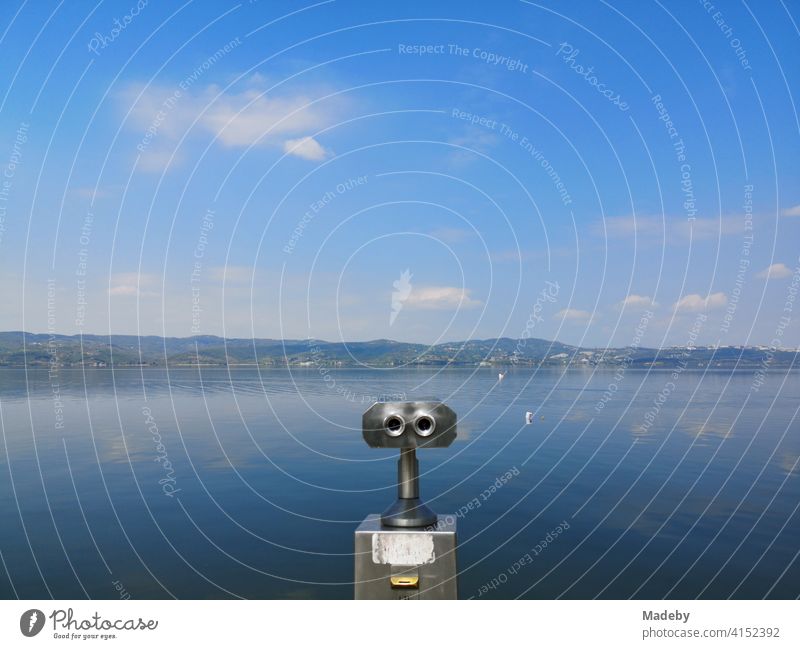 Binoculars with coin operation for tourists in summer with blue sky and sunshine in Sapanca near Adapazari in the province of Sakarya in Turkey Vantage point