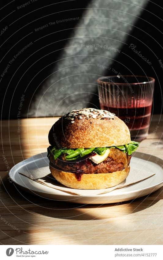 Delicious camembert burger with berry jam background selective focus elegant sweet classic brie table rustic freshness cheese brie cranberry cooking