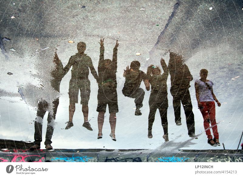 Puddle jump Team spirit people group Peer pressure reflection 7 Jump muck about surreal Friends Friendship Attachment Departure take off