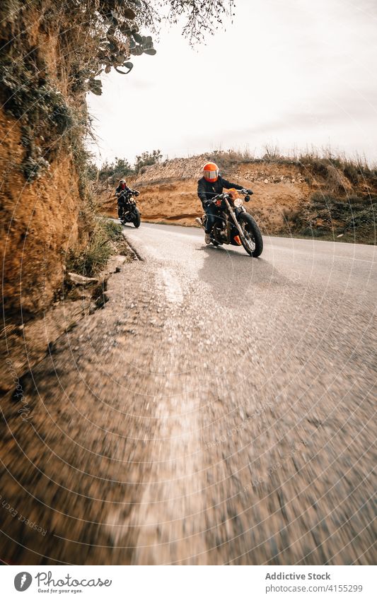 Riders on motorbikes driving on curvy road biker motorcycle ride drive curve speed mountain power fast travel freedom route transport adventure vehicle journey