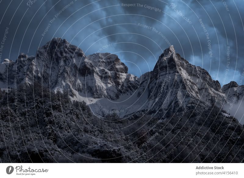 Snowy mountain ridge in winter range snow cloudy sky fog dramatic highland landscape amazing pyrenees huesca spain scenery spectacular cold nature environment