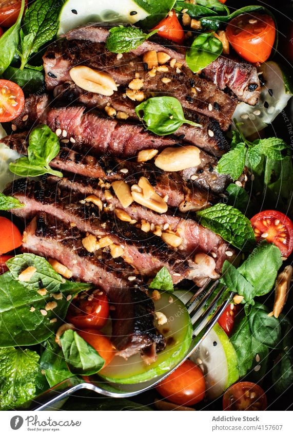 Beef thai salad served on dish mixed soy starter culture eastern roast cooking lunch beef salad top tomato asian cuisine vietnamese meat salad food meal
