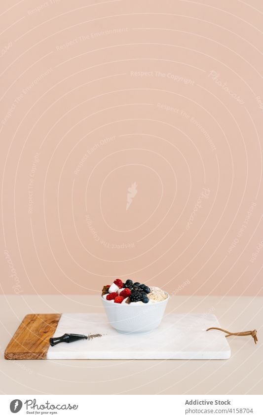 Tasty breakfast bowl on table in kitchen nutrition berry healthy food morning serve muesli vitamin fresh delicious sweet treat natural meal towel various tasty