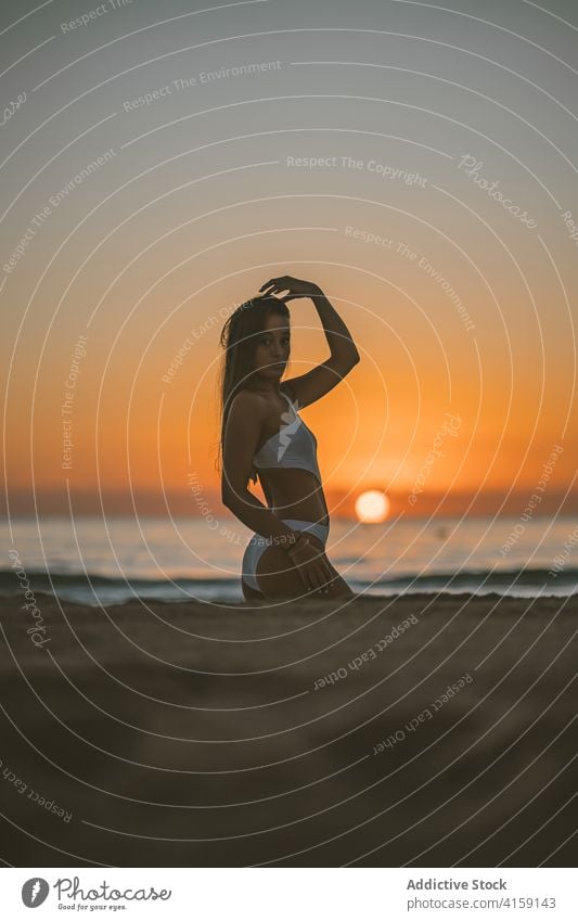 Woman stands in swimsuit beach concept Royalty Free Vector