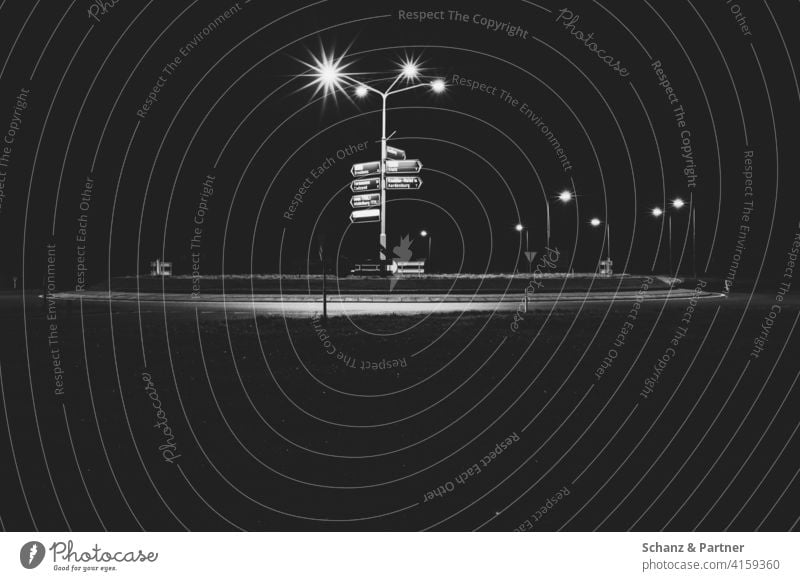 Roundabout with signposts in Belgium Rond point Gyroscope streetlamp Road marking France Night out at night Navigation GPS proceed Dark Lonely Illuminated