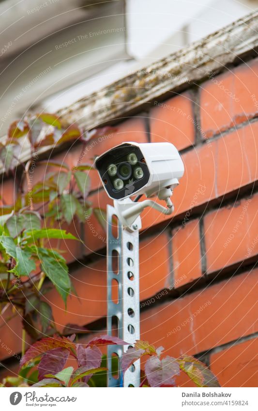 Surveillance and safety home concept. Security CCTV camera monitoring perimeter of private house in village security surveillance cctv system alarm cameras