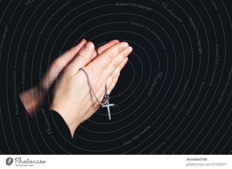 Unrecognizable black woman praying with clasped hands - a Royalty