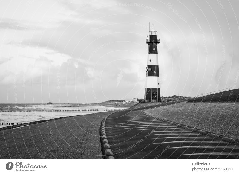 Lighthouse in black and white at the coast, no people lighthouse zeeland breskens zeeuws-vlaanderen the netherlands holland sea beacon ocean ship landscape