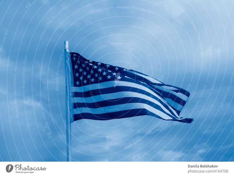 American flag on a blue sky with clouds background american united white usa states waving red wind patriotic stripes patriotism symbol pole banner july 4th