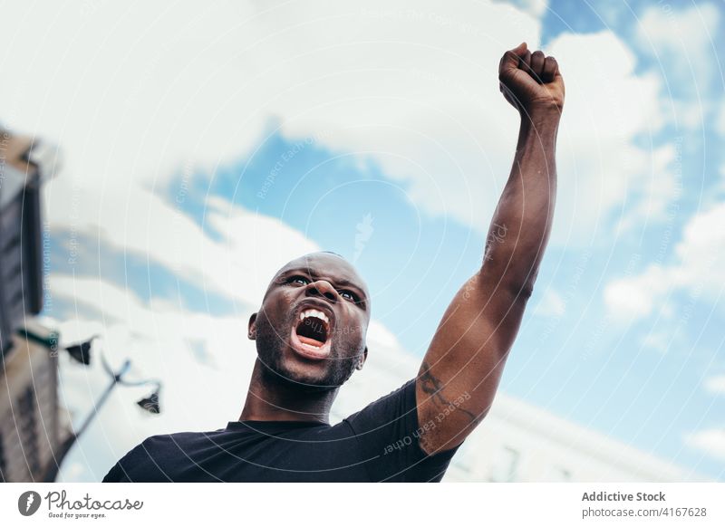 Black man on demonstration against police brutality protest people black racism violence lives social justice black lives matter sign american activism racial