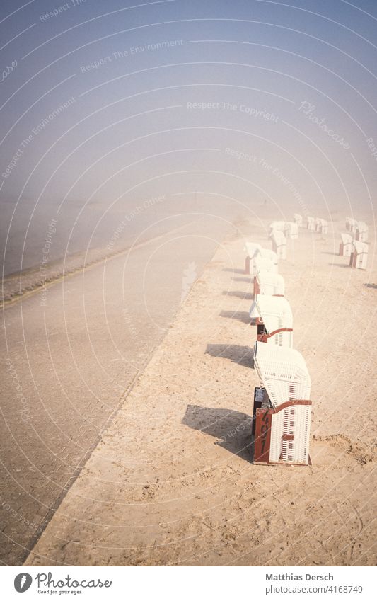 Beach chairs in fog Walk on the beach beach chairs coast coastal strip North Sea North Sea coast North Sea beach North Sea holiday Fog Misty atmosphere