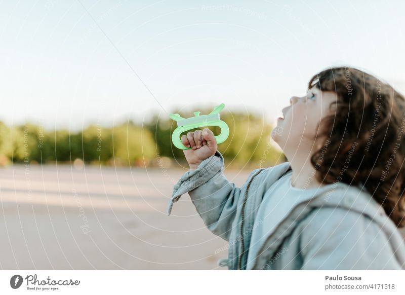 Cute child playing with kite Kite Child childhood 1 - 3 years Caucasian Girl Authentic Spring Colour photo Exterior shot Lifestyle Infancy Day Childhood memory