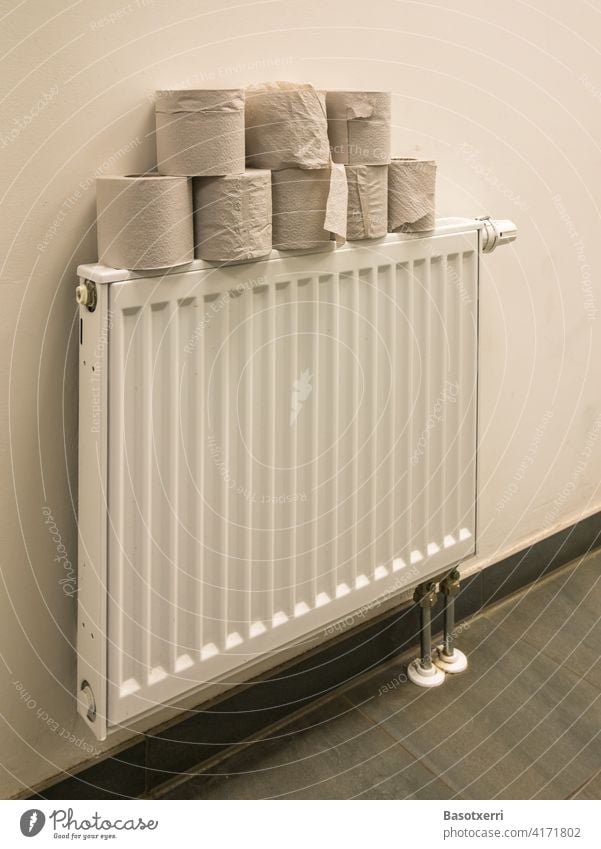 Toilet paper on a radiator LAVATORY Stack Coil toilet paper Toilet paper roll Heater Building hygiene coronavirus Sanitary Living or residing Bathroom Clean