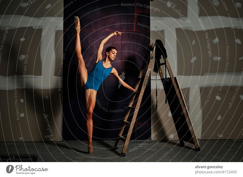 young female ballet dancer at the studio performance flexibility dancing femininity stretching split graceful theatrical professional ballerina performer