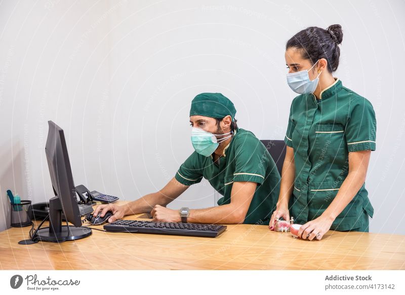 Large Group Female Nurses Working Together Stock Photo by