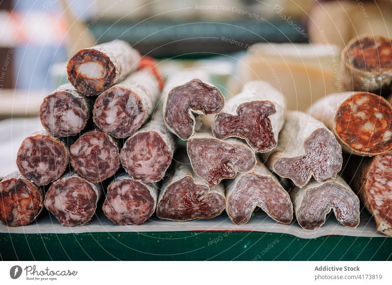 Assortment of artisan meat sausages on market stall assorted various delicious aromatic stack food spicy tasty cuisine meal local tradition gourmet gastronomy