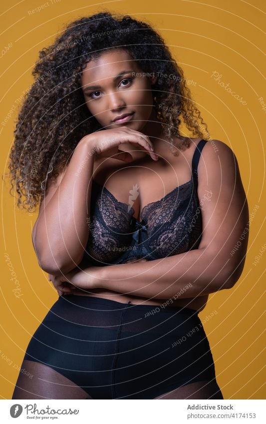 Overweight ethnic woman in lingerie in studio - a Royalty Free Stock Photo  from Photocase