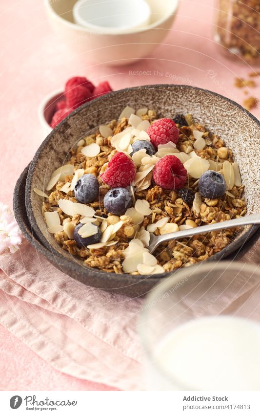 Breakfast with granola, berries and milk breakfast food healthy organic cereal fruit muesli berry bowl grain diet flake snack yogurt fresh natural sweet dessert