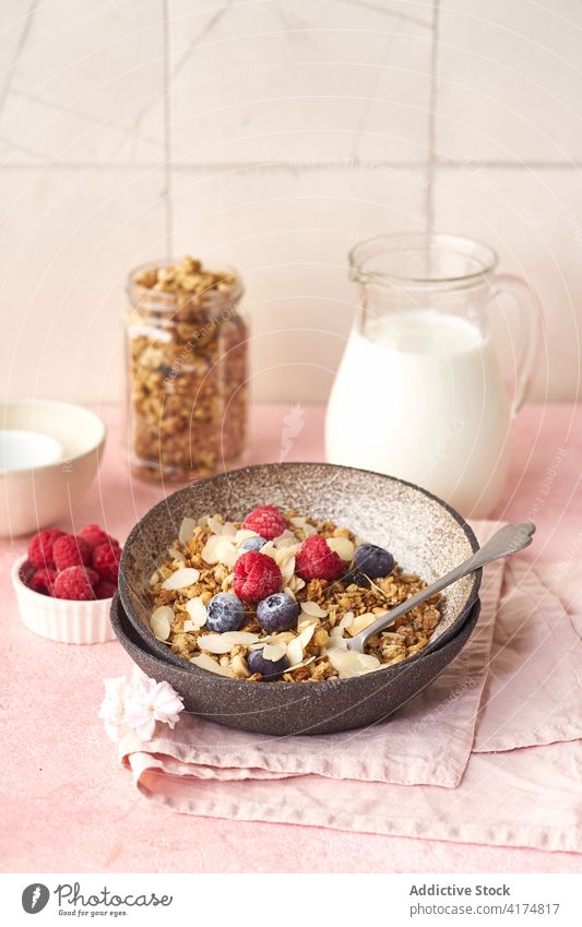 Breakfast with granola, berries and milk breakfast food healthy organic cereal fruit muesli berry bowl grain diet flake snack yogurt fresh natural sweet dessert