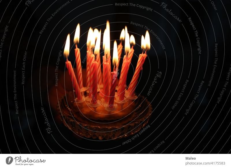 Small cake with candles on a dark background flame small sweet birthday celebration decoration dessert food happy party holiday bright frosting white celebrate