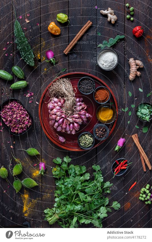 Assorted spices arranged on wooden table ingredient assorted seasoning condiment aromatic greenery herb kitchen natural culinary various fresh organic food