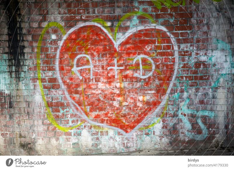 Graffiti, big red heart on a brick wall with the initials of two lovers Love Heart In love Infatuation Display of affection With love Declaration of love