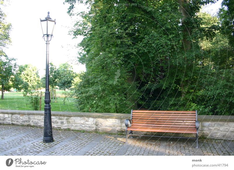 empty park bench & lantern Park Lantern Historic Street lighting Bench Cobblestones Exterior shot