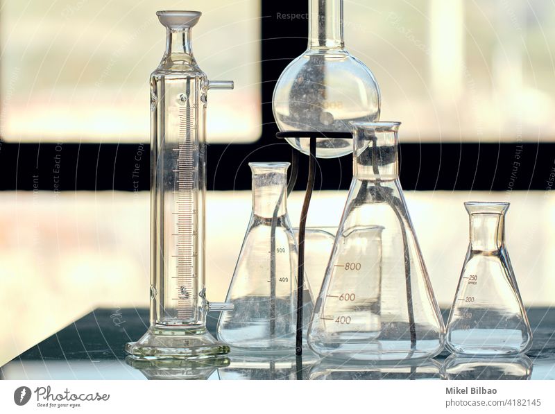 Glass flasks in a scientific laboratory. Science concept. science biotechnology instrument laboratory equipment laboratory flask laboratory glassware