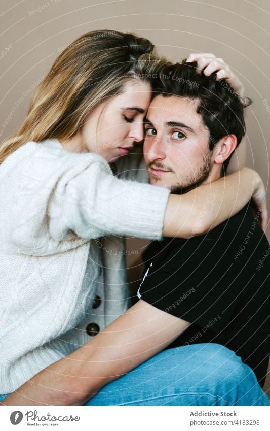 Couple hugging tenderly in studio couple love young together cuddle relationship romantic embrace fondness close romance enjoy boyfriend girlfriend affection