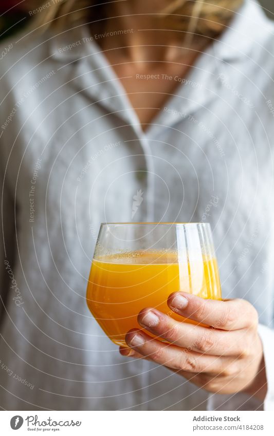 Crop woman with glass of juice orange breakfast fresh drink healthy beverage vitamin female sweet morning delicious food yummy refreshment tasty fruit natural