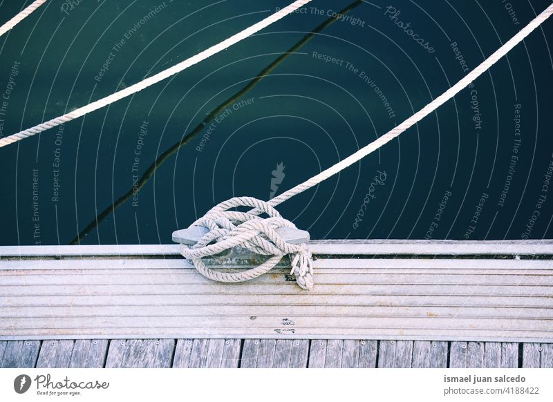 ship rope tied in the harbor - a Royalty Free Stock Photo from
