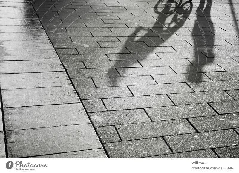 Dialogue of an encounter persons Shadow people conversation meetings Pedestrian cyclist communication chat Places walkway slabs Communicate Footpath