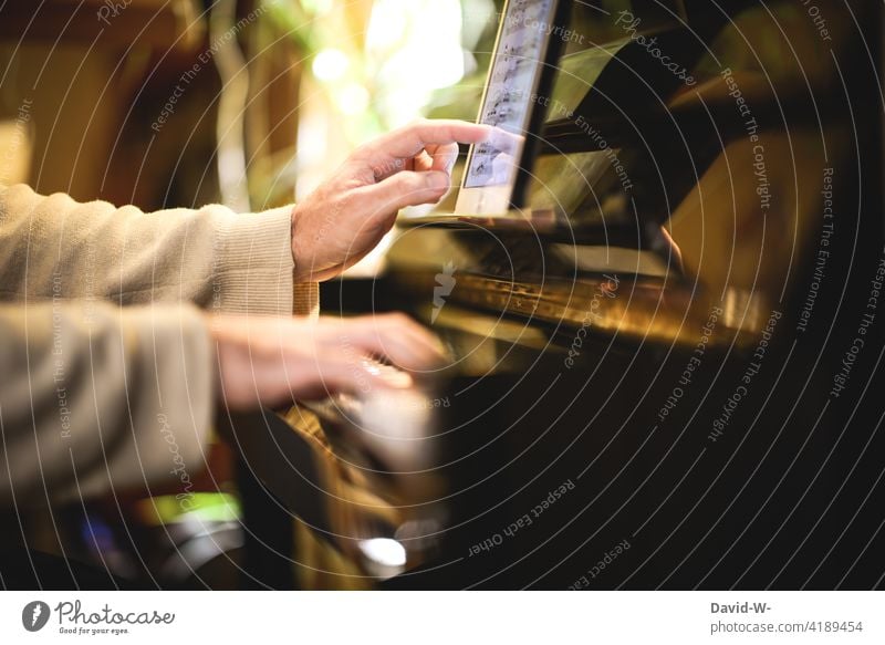 young man practicing the piano Piano Practice Modern Ipad notes Reading hands Pianist Musician Playing Artist