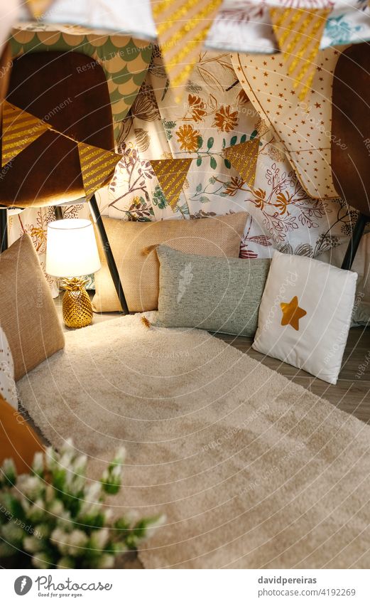 Interior of diy tent at home interior home made tent camping at home pineapple lamp cozy nobody bed sheets decoration indoor homely homemade empty makeshift