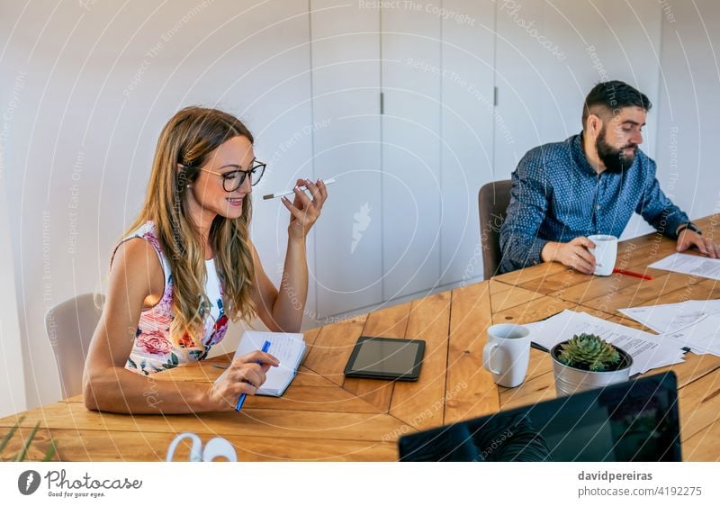 Office worker talking mobile phone with speaker office worker businesswoman talking speaker cell phone coworkers disturb conversation smiling startup