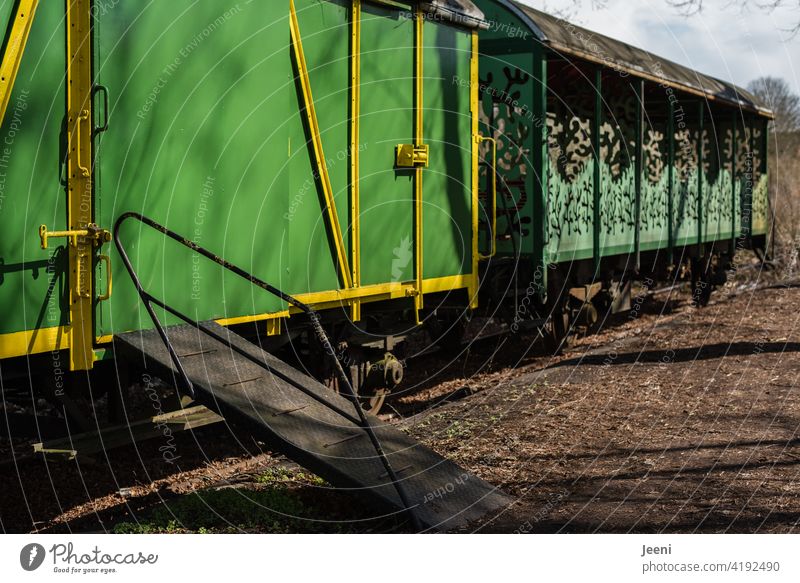 back to the roots | when riding a train was still an experience | old green train cars with ramp Track Train station railcar Wagons Ramp Railroad tracks Green