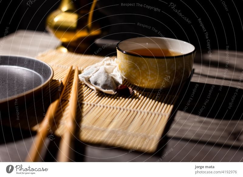 Dark tea background with cup of hot tea on the table. chinese tea china medicine tea - hot drink tea ceremony tea maker table top shot view ingredient organic