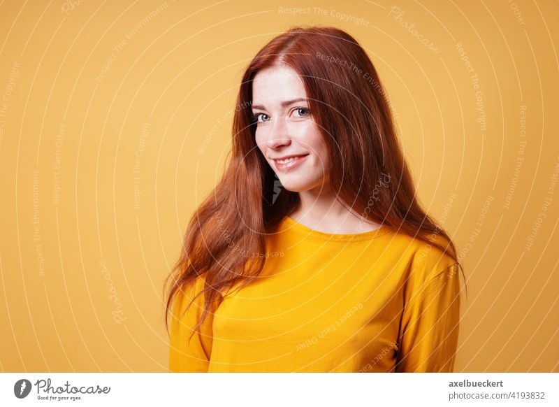 happy young woman with long red hair smiling adult person people pretty girl red-haired female beautiful attractive confidence confident portrait caucasian